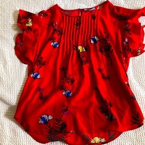 Red floral blouse